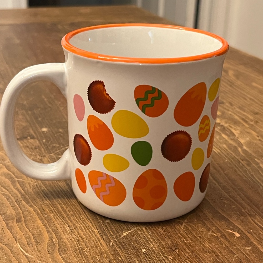 Reese's mug featuring a pattern of Reese's Peanut Butter Cups and Easter eggs.